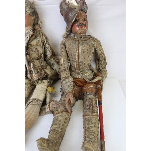 262 - Two large carved wooden dolls with painted faces in 18th century costume believed to be Continental.