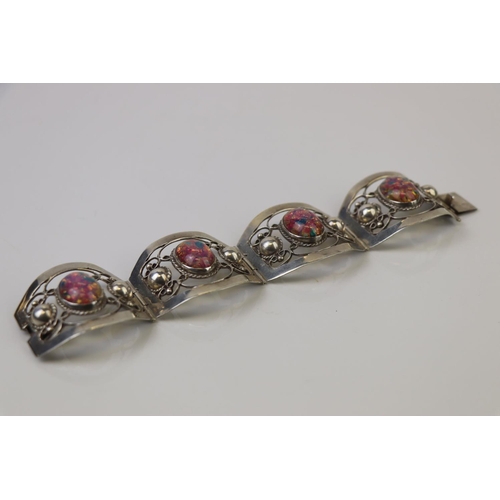 315 - A Mexican 925 sterling silver four panel bracelet.