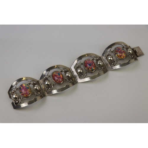 315 - A Mexican 925 sterling silver four panel bracelet.