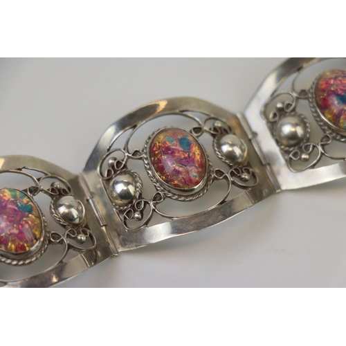 315 - A Mexican 925 sterling silver four panel bracelet.