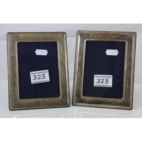 323 - A pair of fully hallmarked sterling silver photograph frames.