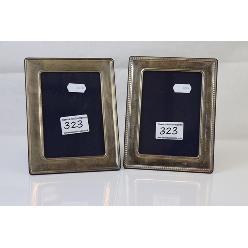 323 - A pair of fully hallmarked sterling silver photograph frames.