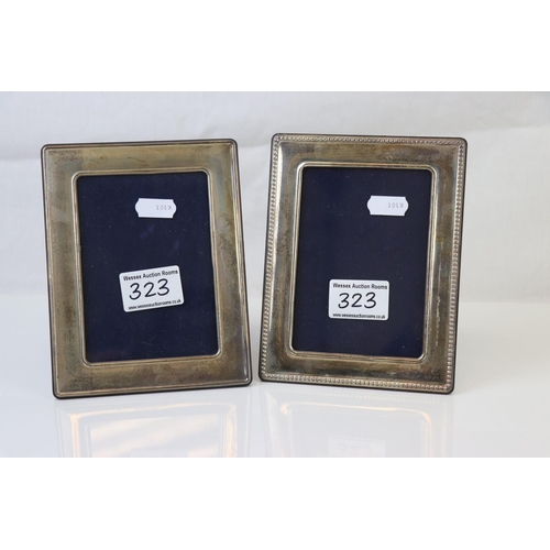 323 - A pair of fully hallmarked sterling silver photograph frames.