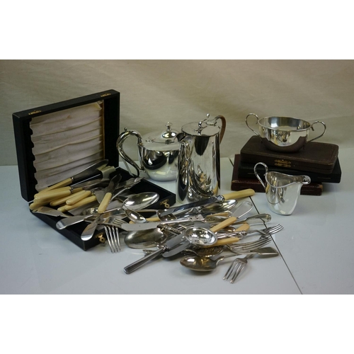 358 - A quantity of silverplate to include tea set and cutlery.