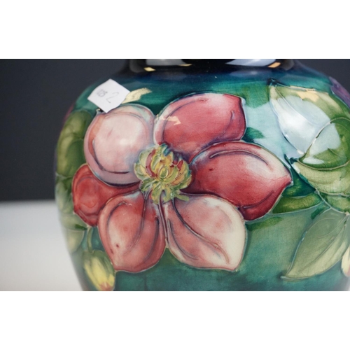 4 - Moorcroft Globular Vase in the Clematis pattern on a green ground, Moorcroft signature to base and i... 