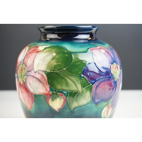 4 - Moorcroft Globular Vase in the Clematis pattern on a green ground, Moorcroft signature to base and i... 