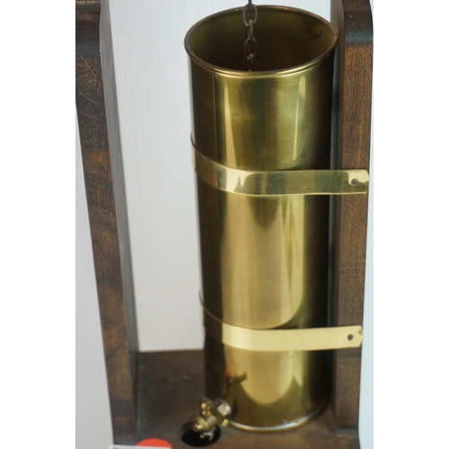 40 - Art Nouveau style wooden and brass mounted water clock.