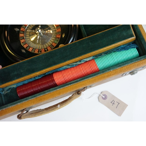 47 - A vintage cased games compendium including back gammon and roulette wheel etc