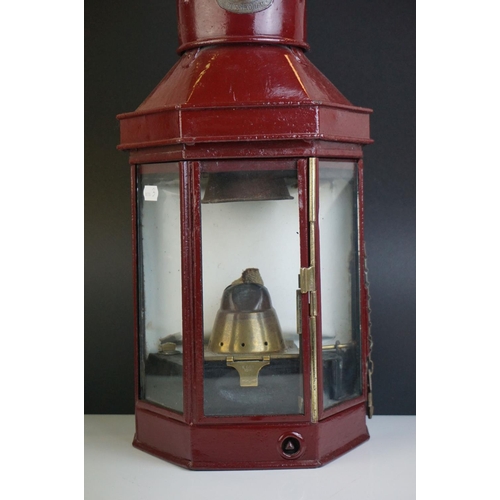 62 - Eli Griffiths & Sons of Birmingham Ships Lamp, Maroon finish, 1918, with exterior wick adjust, 52cms... 