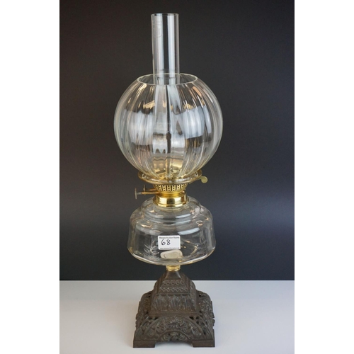 68 - Victorian Oil Lamp with clear glass well and stepped cast iron base, bulbous fluted clear glass shad... 