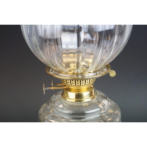68 - Victorian Oil Lamp with clear glass well and stepped cast iron base, bulbous fluted clear glass shad... 