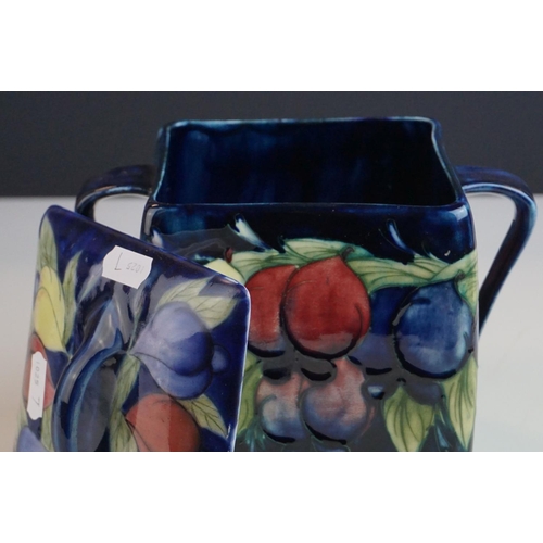 7 - Moorcroft Biscuit Barrel in the Wisteria pattern on a blue ground, restoration to lid, Moorcroft sig... 