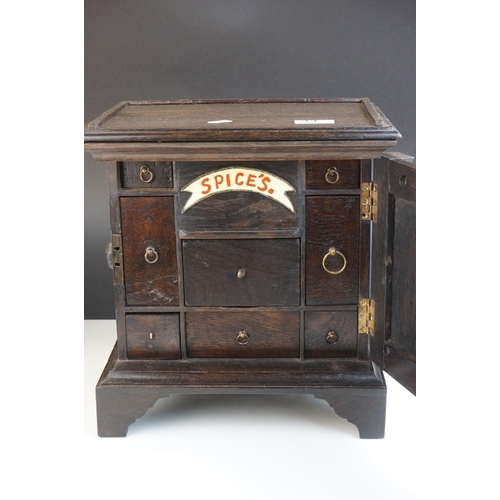 94 - 19th century Oak Spice Cupboard opening to eight drawers