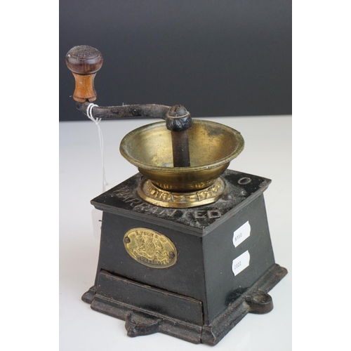 96 - An early 20th century E Pugh and Co  cast iron coffee grinder.