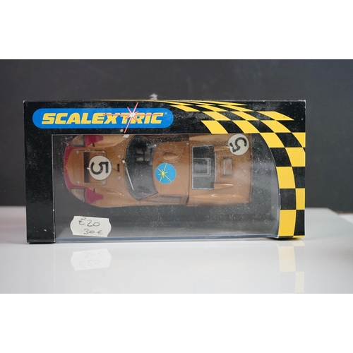 1034 - Five cased / boxed Scalextric slot cars to include C2548 Indy Car plain white, C2472 Ford GT40 plain... 