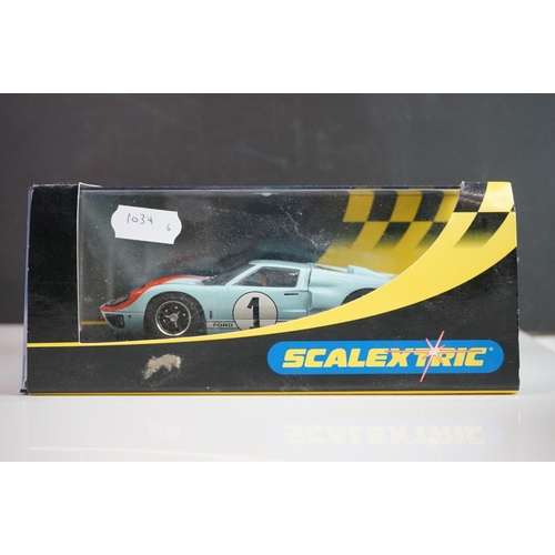 1034 - Five cased / boxed Scalextric slot cars to include C2548 Indy Car plain white, C2472 Ford GT40 plain... 