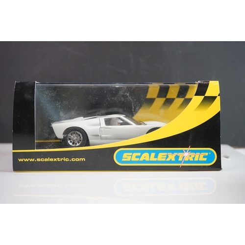 1034 - Five cased / boxed Scalextric slot cars to include C2548 Indy Car plain white, C2472 Ford GT40 plain... 