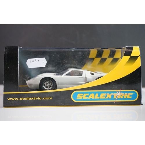 1034 - Five cased / boxed Scalextric slot cars to include C2548 Indy Car plain white, C2472 Ford GT40 plain... 