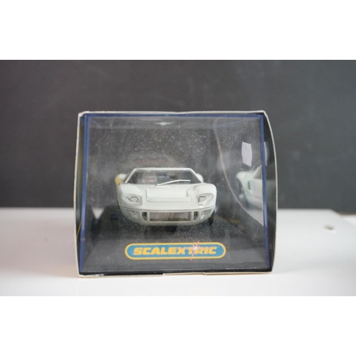 1034 - Five cased / boxed Scalextric slot cars to include C2548 Indy Car plain white, C2472 Ford GT40 plain... 