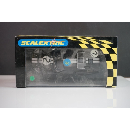 1034 - Five cased / boxed Scalextric slot cars to include C2548 Indy Car plain white, C2472 Ford GT40 plain... 