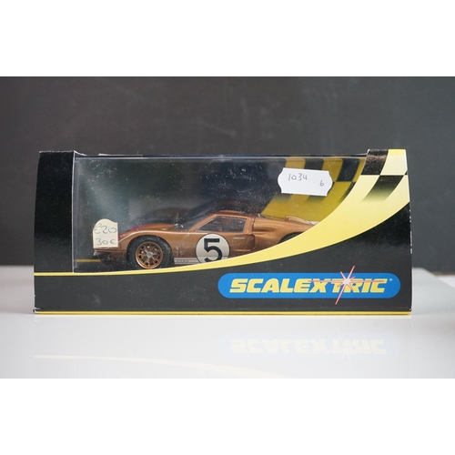 1034 - Five cased / boxed Scalextric slot cars to include C2548 Indy Car plain white, C2472 Ford GT40 plain... 