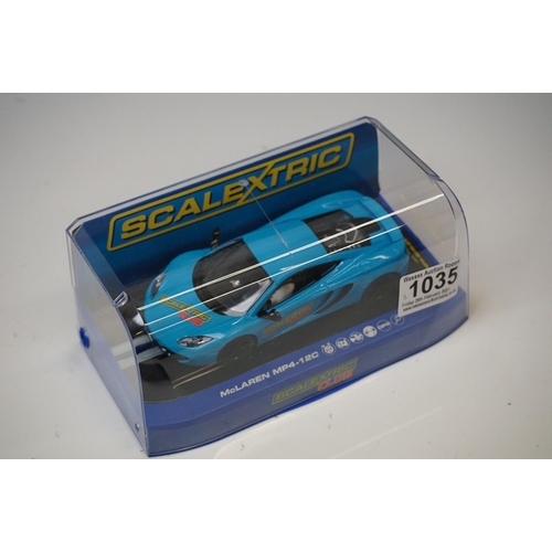 1035 - Three cased Scalextric slot cars to include ltd edn C3327 McLaren MP4-12C Scalextric Club 2012, C296... 