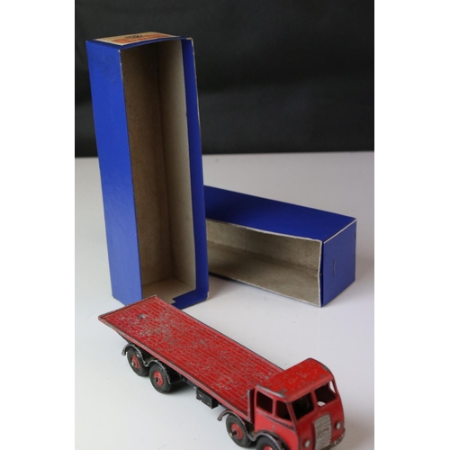 1052 - Two boxed Dinky Supertoys diecast models to include 502 Foden Flat Truck in red (heavy playwear) and... 