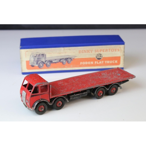 1052 - Two boxed Dinky Supertoys diecast models to include 502 Foden Flat Truck in red (heavy playwear) and... 