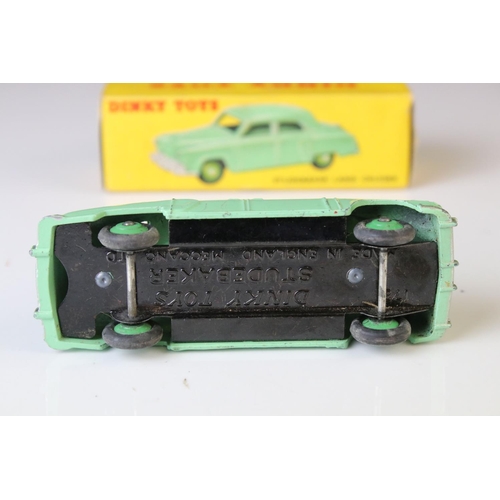 1179 - Boxed Dinky 172 Studebaker Land Cruiser diecast model in mint green, dark green hubs, showing play w... 