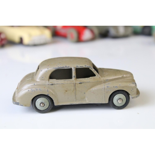 1184 - 12 Mid 20th C play worn Dinky diecast models to include 8 x racing cars, Rover 75, Vanguard etc