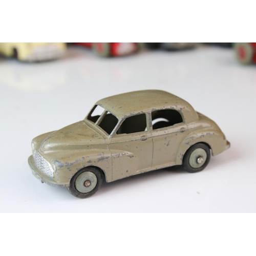 1184 - 12 Mid 20th C play worn Dinky diecast models to include 8 x racing cars, Rover 75, Vanguard etc