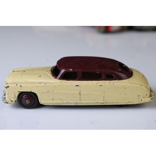 1184 - 12 Mid 20th C play worn Dinky diecast models to include 8 x racing cars, Rover 75, Vanguard etc