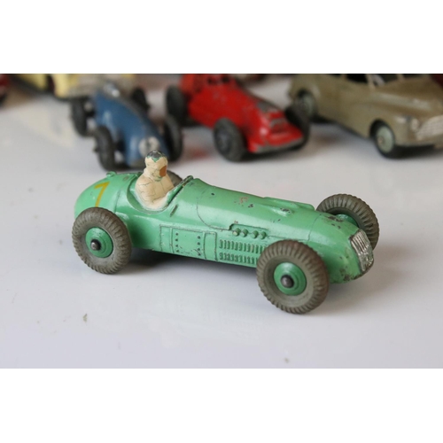 1184 - 12 Mid 20th C play worn Dinky diecast models to include 8 x racing cars, Rover 75, Vanguard etc