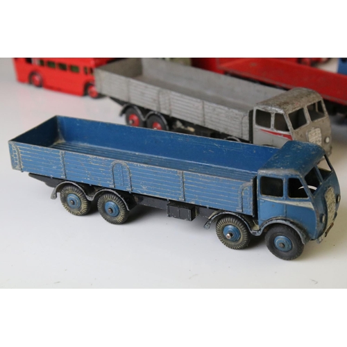 1185 - 16 Mid 20th C play worn Dinky diecast models to include 3 x Foden, 11 x various buses, etc