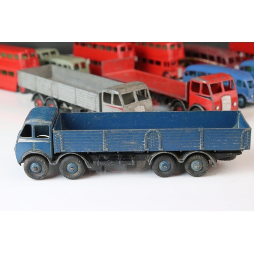 1185 - 16 Mid 20th C play worn Dinky diecast models to include 3 x Foden, 11 x various buses, etc