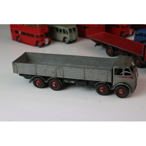 1185 - 16 Mid 20th C play worn Dinky diecast models to include 3 x Foden, 11 x various buses, etc