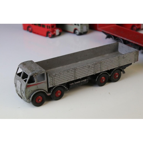 1185 - 16 Mid 20th C play worn Dinky diecast models to include 3 x Foden, 11 x various buses, etc