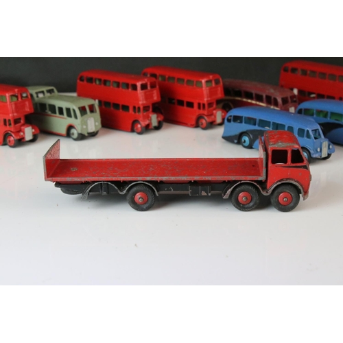 1185 - 16 Mid 20th C play worn Dinky diecast models to include 3 x Foden, 11 x various buses, etc