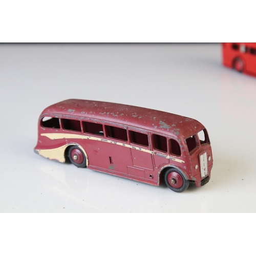 1185 - 16 Mid 20th C play worn Dinky diecast models to include 3 x Foden, 11 x various buses, etc