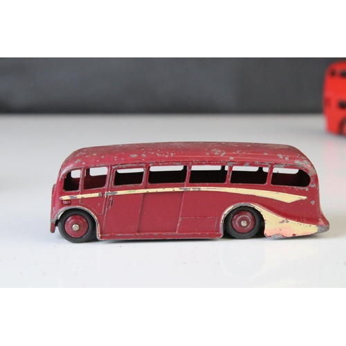 1185 - 16 Mid 20th C play worn Dinky diecast models to include 3 x Foden, 11 x various buses, etc