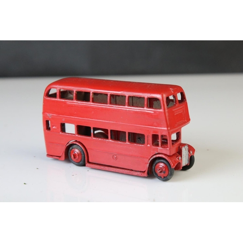 1185 - 16 Mid 20th C play worn Dinky diecast models to include 3 x Foden, 11 x various buses, etc