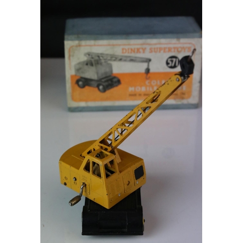 1191 - Two boxed Dinky Supertoys to include 561 Blaw Knox Bulldozer in red and 571 Coles Mobile Crane, both... 