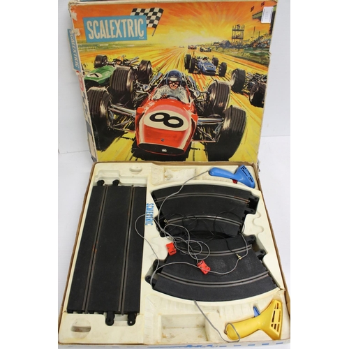 1224 - Large quantity of Scalextric to include 6 x slot cars, various track, controllers etc contained with... 