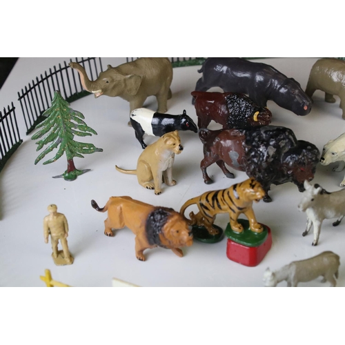 1298 - Quantity of mid 20th C metal zoo animals and zoo accessories to include Britains examples, vg overal... 