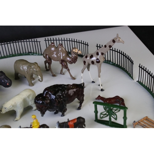 1298 - Quantity of mid 20th C metal zoo animals and zoo accessories to include Britains examples, vg overal... 