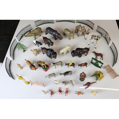 1298 - Quantity of mid 20th C metal zoo animals and zoo accessories to include Britains examples, vg overal... 