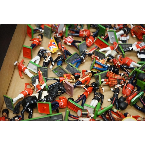 1336 - Large quantity of Britains metal figures on metal stands, various guards and regiments with 2 x hors... 