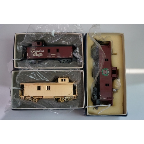 276 - Three boxed HO gauge brass Caboose models to include 2 x CNR Modern Caboose (one painted, one unpain... 