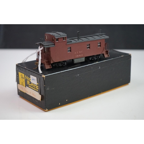 277 - Three boxed HO gauge Nickel Plate Product items of brass rolling stock to include 2 x Reading Caboos... 