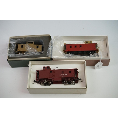 285 - Three boxed HO gauge items of rolling stock to include Trains Inc Santa Fe Side Door Caboose (painte... 